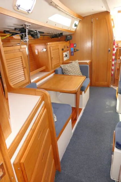Slide: The Image of Interior of 1995 Catalina 36 Mk II sailboat with wooden cabinetry and seating area. - 7