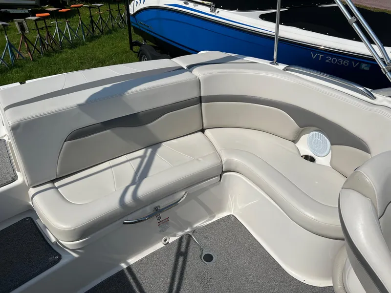 Slide: The Image of 2007 Chaparral 220 SSi boat interior with white leather seating and speaker. - 10