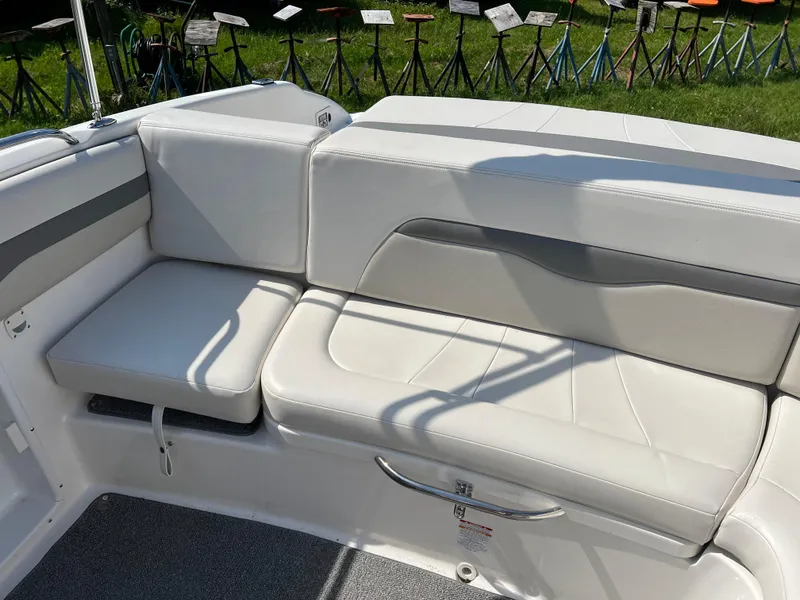 Slide: The Image of 2007 Chaparral 220 SSi boat interior with white leather seating. - 13