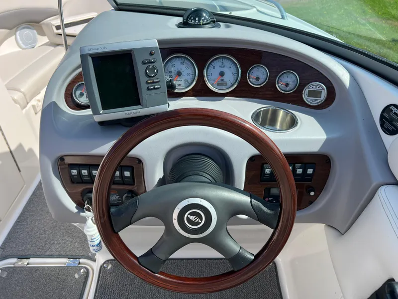 Slide: The Image of 2007 Chaparral 220 SSi boat dashboard with steering wheel and gauges. - 14
