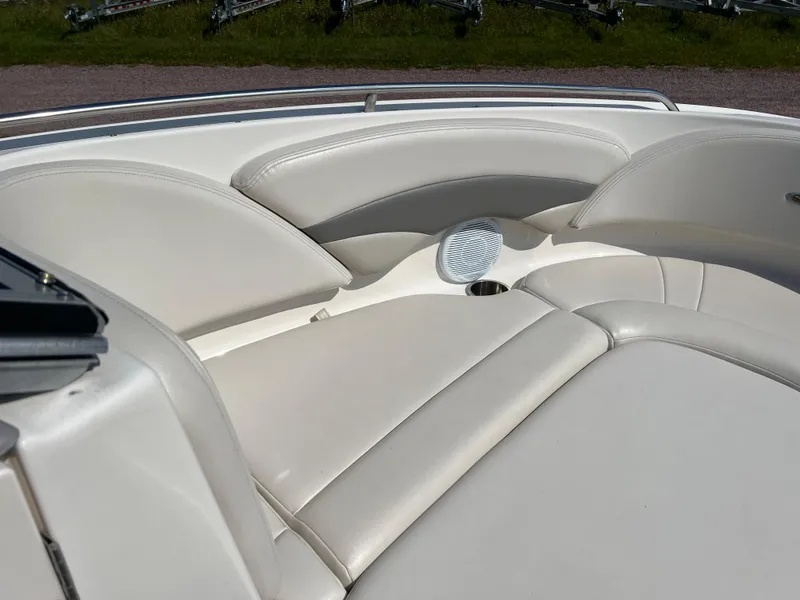 Slide: The Image of 2007 Chaparral 220 SSi boat interior with white leather seating and speaker. - 20