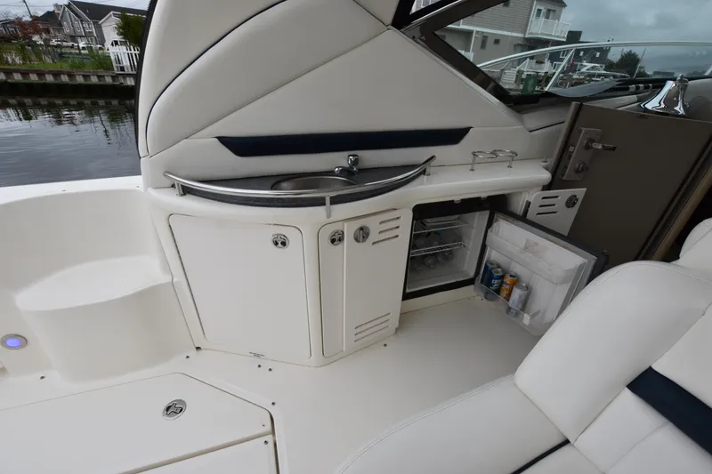 Slide: The Image of 2005 Sea Ray 420 Sundancer yacht interior with kitchenette and mini fridge. - 14