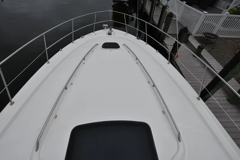 Slide: The Image of Bow view of 2005 Sea Ray 420 Sundancer yacht docked at marina. - 34