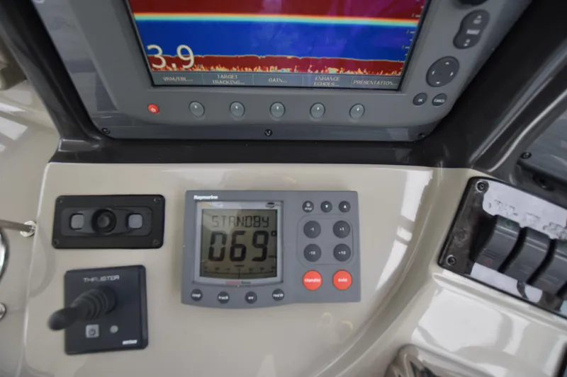 Slide: The Image of Control panel of a 2005 Sea Ray 420 Sundancer boat with navigation instruments. - 45