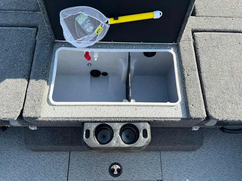 Slide: The Image of 2025 Lund 2075 Impact XS Sport boat interior with livewell and fishing net. - 12