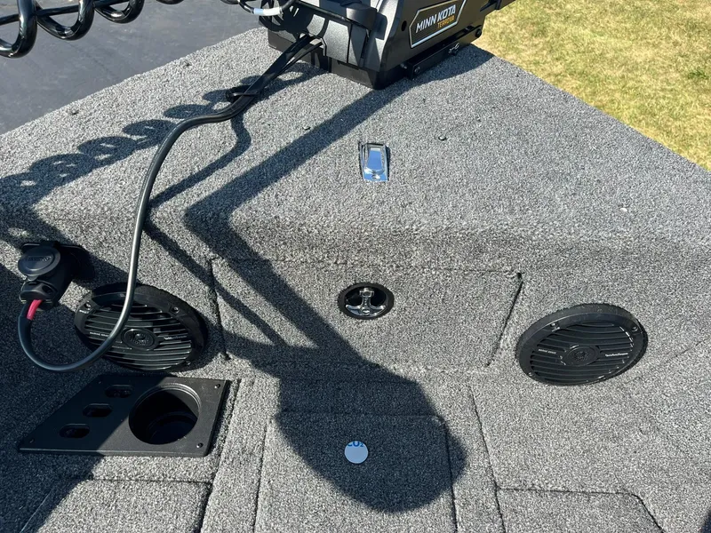 Slide: The Image of 2025 Lund 2075 Impact XS Sport boat deck with speakers and trolling motor. - 20