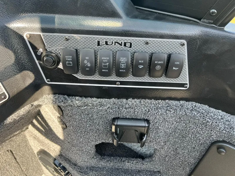 Slide: The Image of Control panel of 2025 Lund 2075 Impact XS Sport boat. - 21