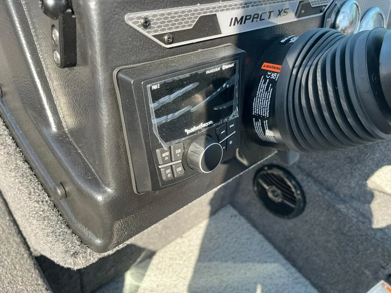 Slide: The Image of 2025 Lund 2075 Impact XS Sport dashboard with Rockford Fosgate audio system. - 22