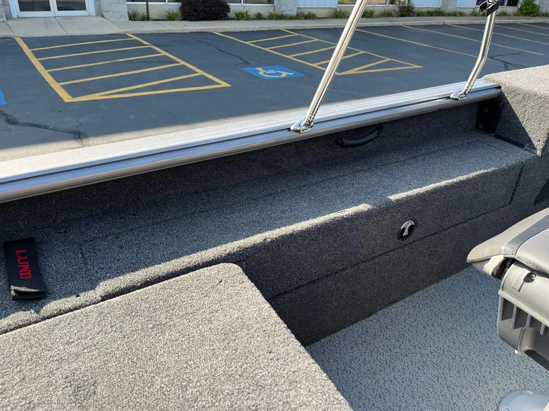 Slide: The Image of 2025 Lund 2075 Impact XS Sport boat interior with seating and storage. - 25