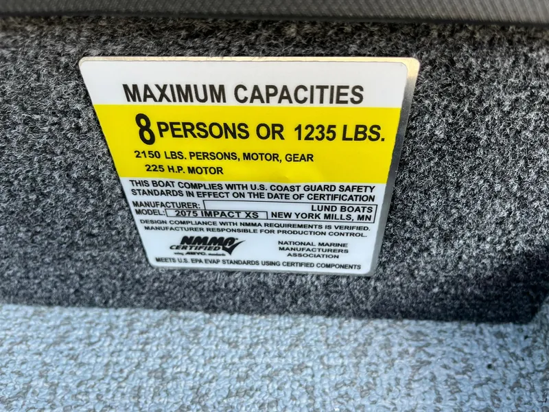 Slide: The Image of Capacity label for 2025 Lund 2075 Impact XS Sport boat, 8 persons or 1235 lbs. - 30