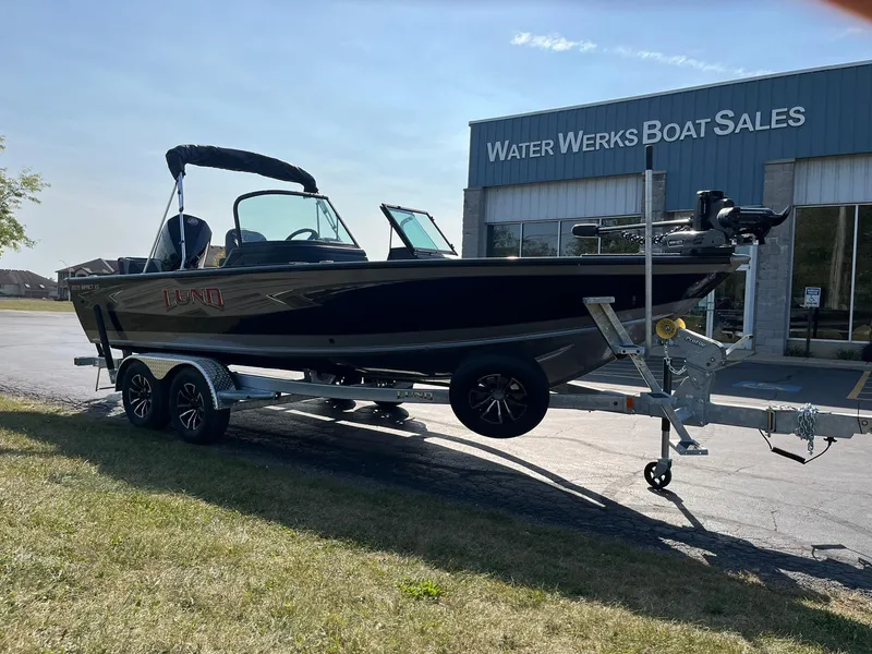 Slide: The Image of 2025 Lund 2075 Impact XS Sport boat on trailer at Water Werks Boat Sales. - 6