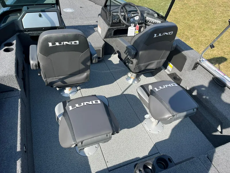 Slide: The Image of 2025 Lund 2075 Impact XS Sport boat interior with four branded seats. - 9