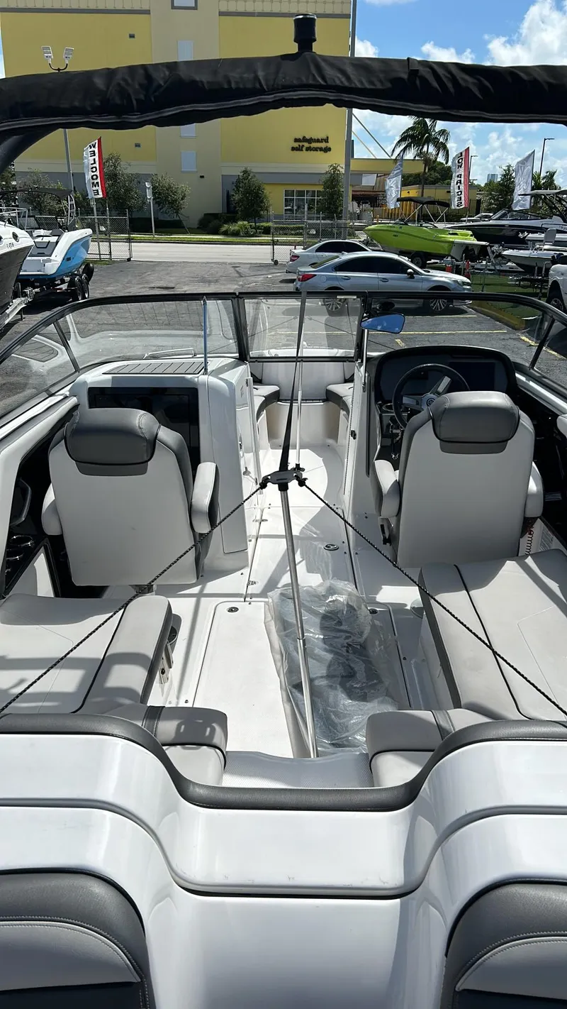 Slide: The Image of 2019 Yamaha Boats AR240 interior with seating and steering console. - 17
