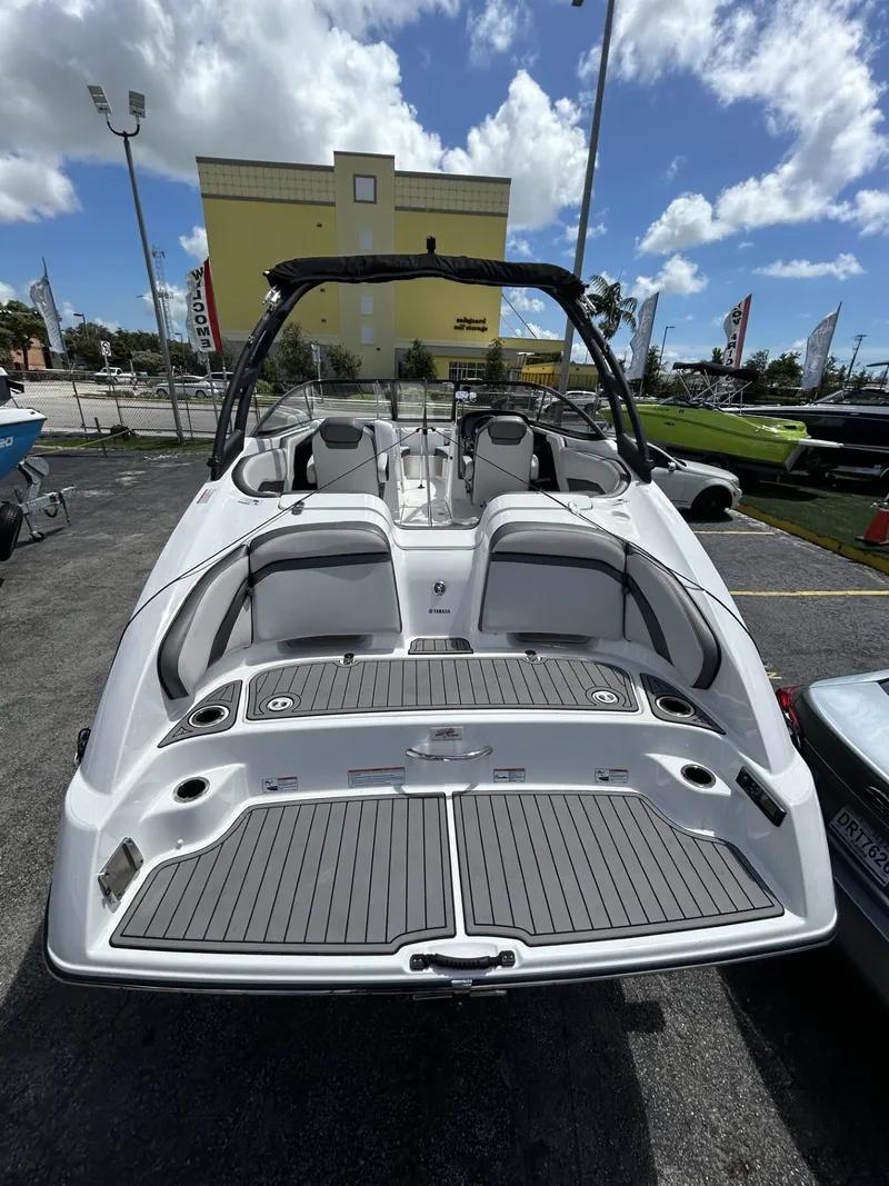 Slide: The Image of 2019 Yamaha Boats AR240, sleek design, spacious seating, outdoor display. - 24
