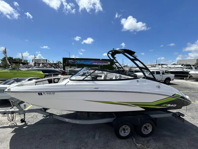 Slide: The Image of 2019 Yamaha AR240 boat on trailer under clear blue sky. - 25