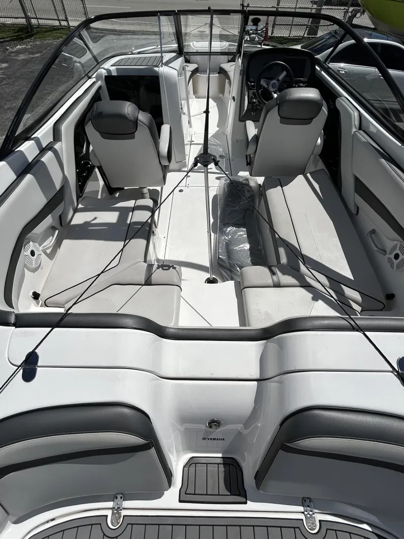 Slide: The Image of 2019 Yamaha Boats AR240 interior, featuring sleek seating and modern design. - 27