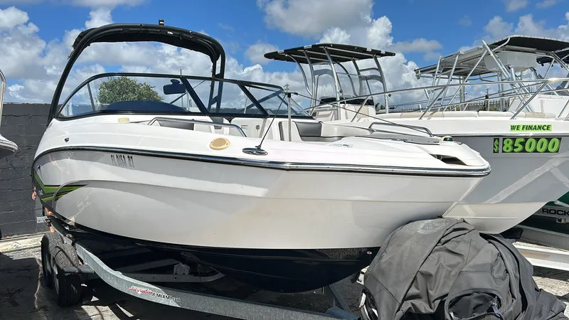 Slide: The Image of 2019 Yamaha AR240 boat on trailer under blue sky. - 7