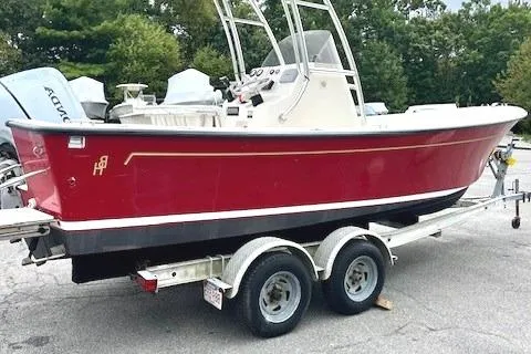 Slide: The Image of Red 2007 Bristol Harbor 21 CC boat on trailer, parked outdoors. - 0