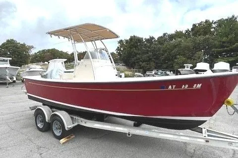 Slide: The Image of Red 2007 Bristol Harbor 21 CC boat on trailer, parked outdoors. - 1