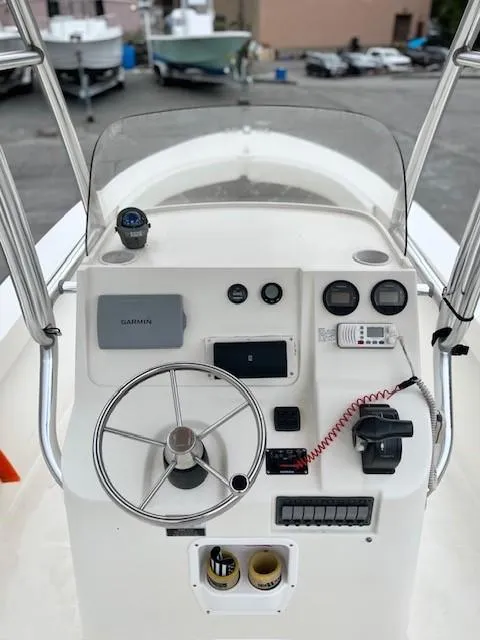 Slide: The Image of 2007 Bristol Harbor 21 CC boat console with steering wheel and navigation instruments. - 5