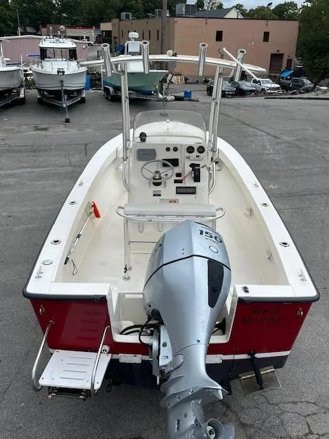Slide: The Image of 2007 Bristol Harbor 21 CC boat with outboard motor, docked in a marina. - 6
