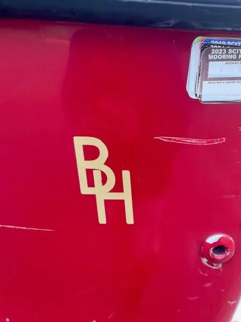 Slide: The Image of Red 2007 Bristol Harbor 21 CC boat with "BH" logo and mooring sticker. - 7