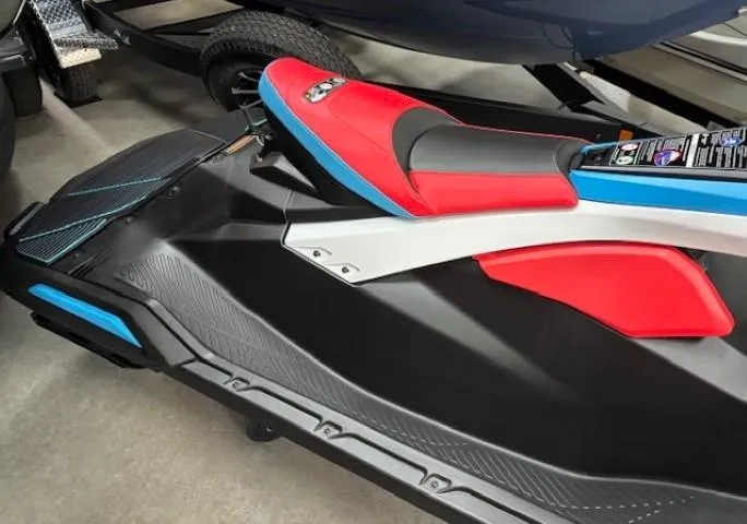 Slide: The Image of 2025 Yamaha WaveRunner JetBlaster DLX 2-Up, vibrant red and blue seat design. - 3