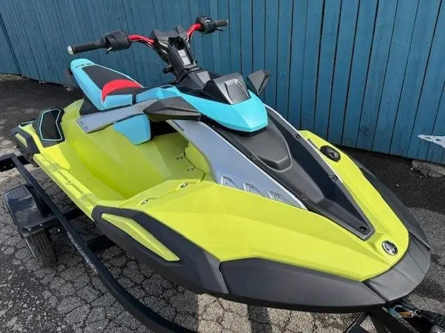 Slide: The Image of 2025 Yamaha WaveRunner JetBlaster PRO 2-Up in vibrant yellow and blue on a trailer. - 1