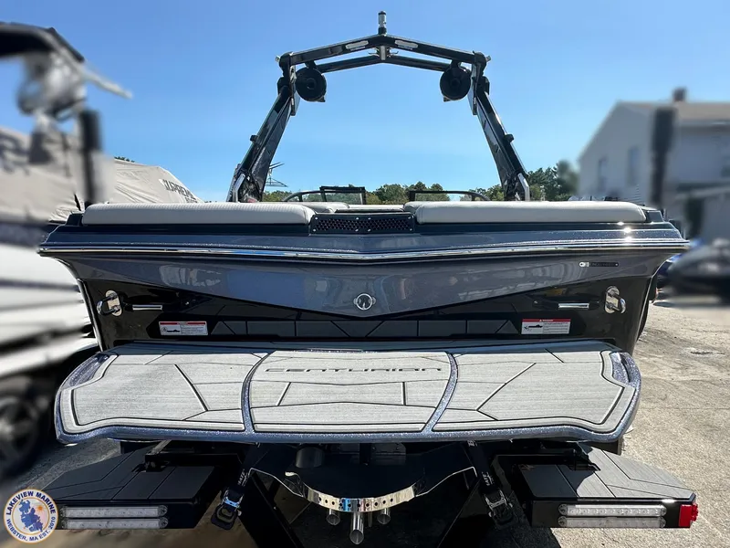 Slide: The Image of 2023 Centurion Vi22 boat rear view with swim platform and wakeboard tower. - 1