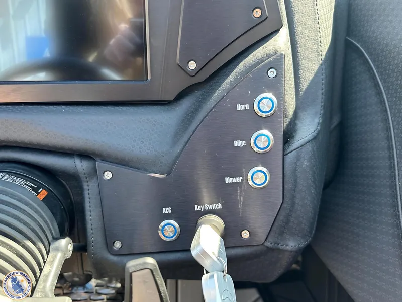 Slide: The Image of 2023 Centurion Vi22 dashboard controls with key switch and buttons. - 10