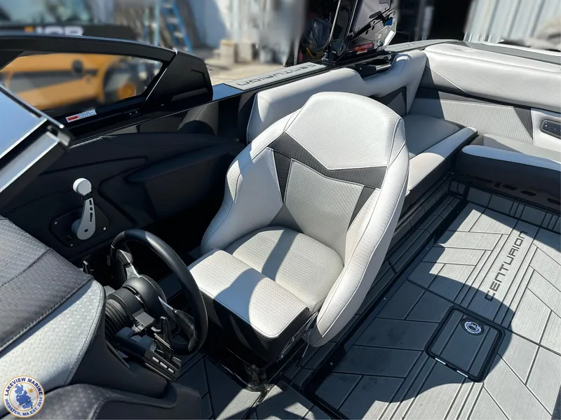 Slide: The Image of 2023 Centurion Vi22 boat interior with sleek seating and modern dashboard design. - 11