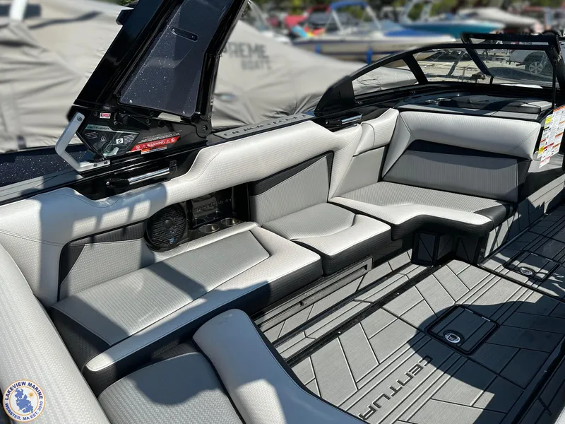 Slide: The Image of 2023 Centurion Vi22 boat interior with sleek gray seating and modern design. - 13