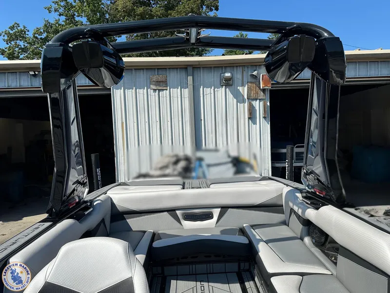 Slide: The Image of 2023 Centurion Vi22 boat interior with sleek seating and tower speakers. - 14