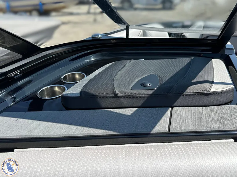 Slide: The Image of 2023 Centurion Vi22 boat interior with cup holders and cushioned seating. - 19