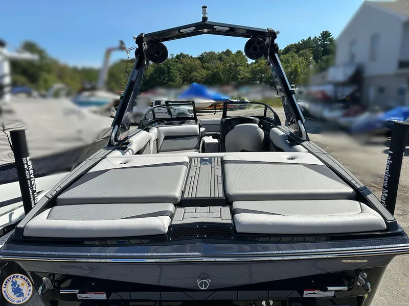 Slide: The Image of 2023 Centurion Vi22 boat with sleek design and spacious seating. - 2