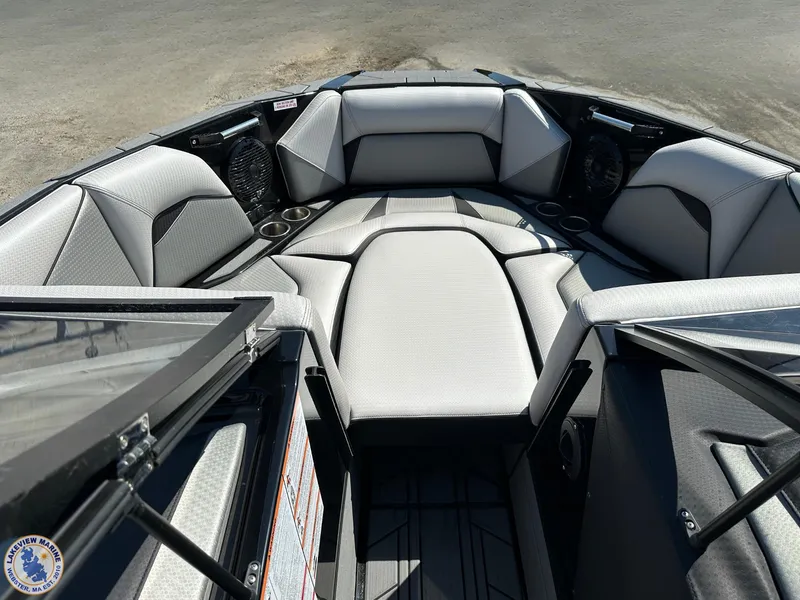 Slide: The Image of 2023 Centurion Vi22 boat interior with sleek seating and cup holders. - 4