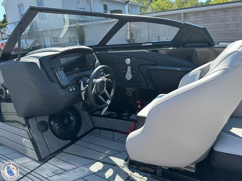 Slide: The Image of 2023 Centurion Vi22 boat interior with modern dashboard and seating. - 7