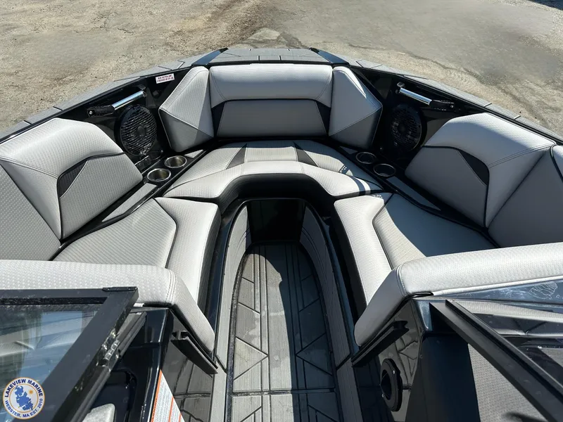 Slide: The Image of 2023 Centurion Vi22 boat interior with gray seating and cup holders. - 8