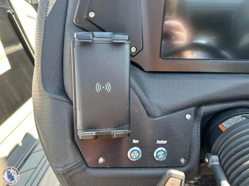 Slide: The Image of 2023 Centurion Vi22 dashboard with wireless charger and navigation controls. - 9