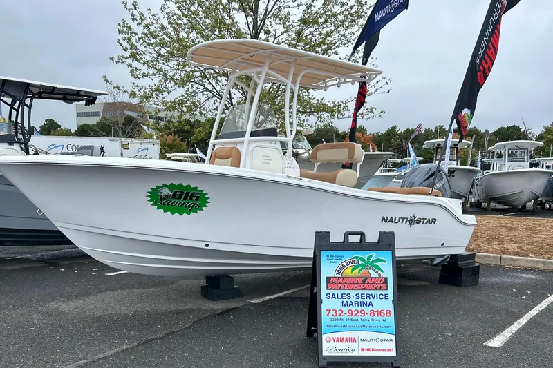 Slide: The Image of 2025 NauticStar 212 Legacy boat with Yamaha 150 outboard motor, rear view. - 8
