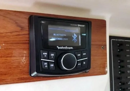 Slide: The Image of Bluetooth stereo system on 1999 Mainship 30 boat, mounted on wooden panel. - 10