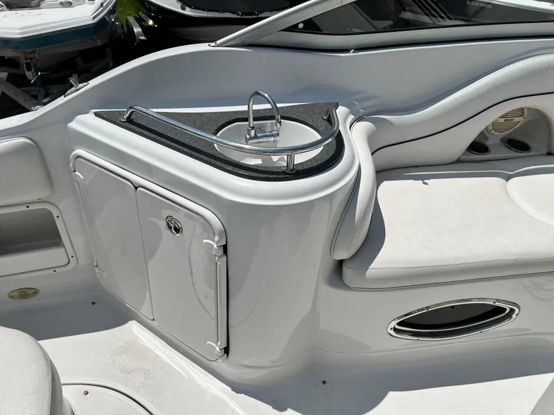 Slide: The Image of 2006 Crownline 250cr boat interior with sink and seating area. - 5