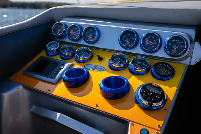 Slide: The Image of Dashboard of a 2007 Cigarette 42X boat with multiple gauges and controls. - 12
