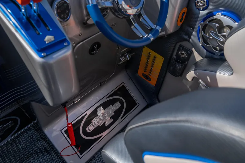 Slide: The Image of Interior of a 2007 Cigarette 42X boat with blue accents and steering wheel. - 20