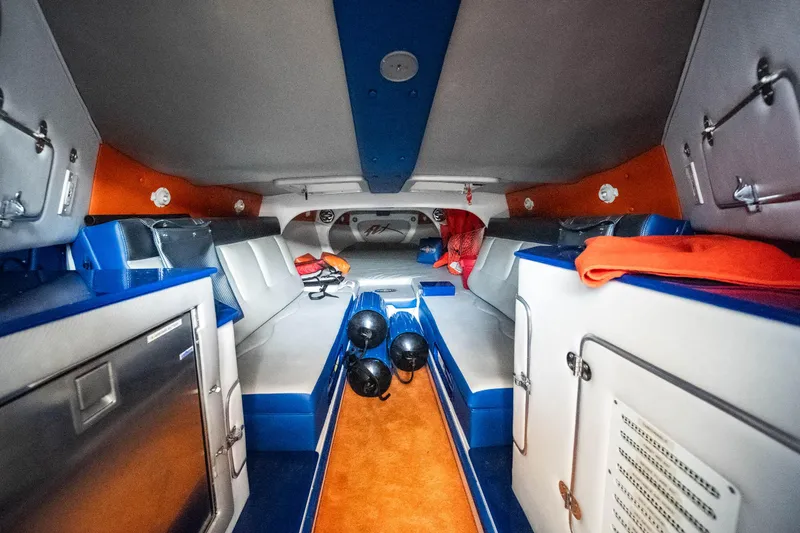Slide: The Image of Interior of 2007 Cigarette 42X boat with vibrant orange and blue accents. - 25