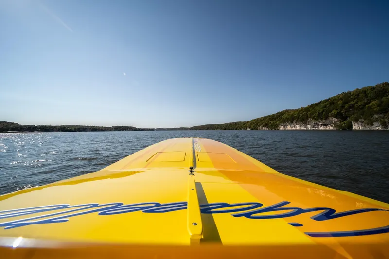 Slide: The Image of Yellow 2007 Cigarette 42X boat on a lake, clear sky, scenic view. - 28