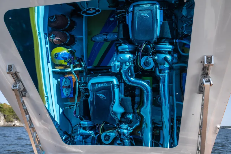 Slide: The Image of Engine compartment of 2007 Cigarette 42X boat, showcasing intricate mechanical components. - 31
