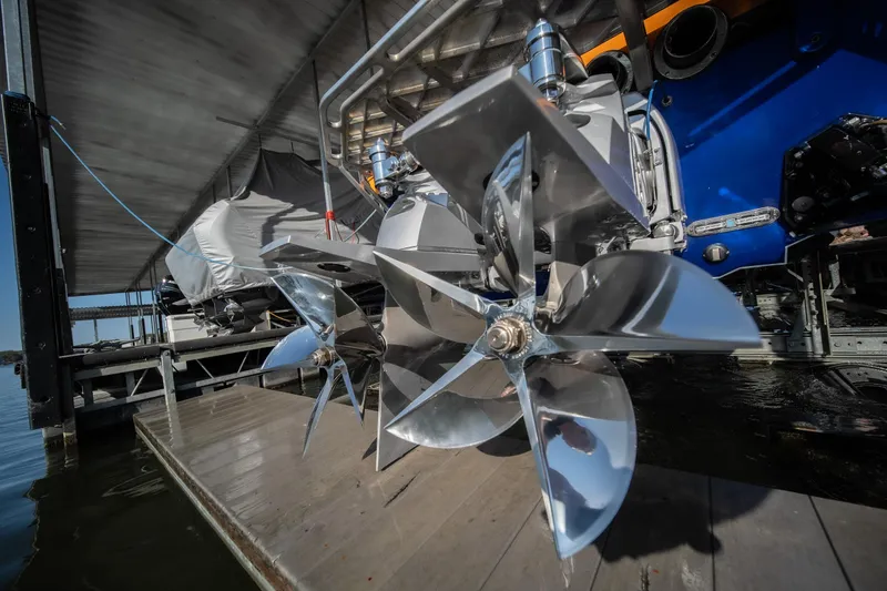 Slide: The Image of Close-up of 2007 Cigarette 42X boat propellers in a dock setting. - 36