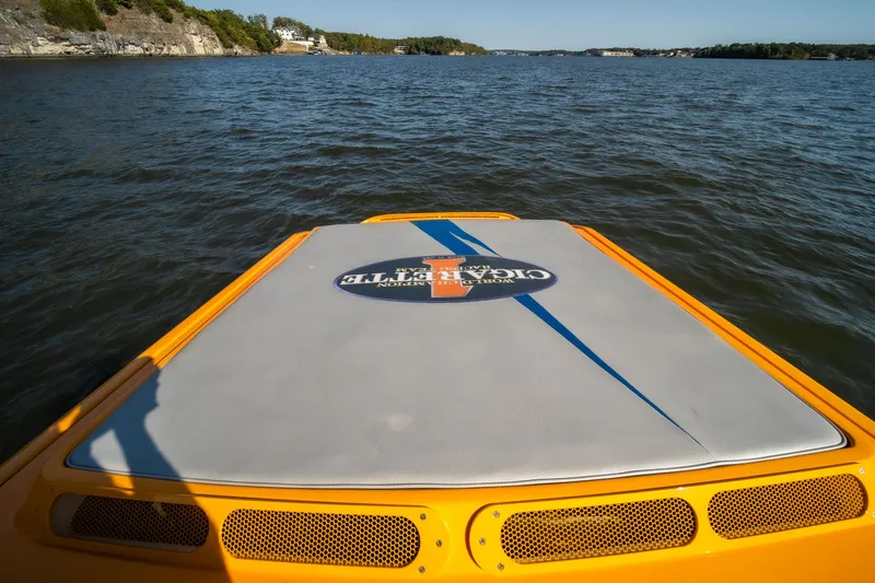 Slide: The Image of 2007 Cigarette 42X boat on water, rear view with logo, sunny day. - 5
