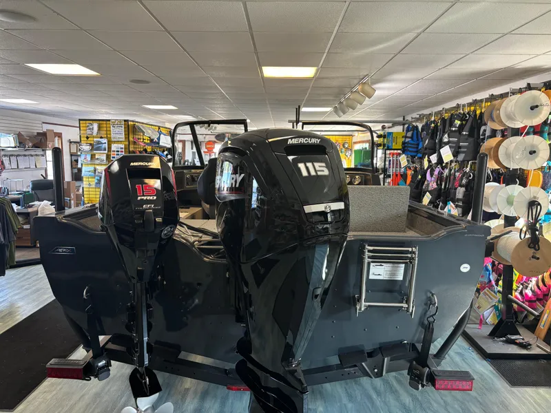 Slide: The Image of 2025 Crestliner 1750 Fish Hawk WT JS boat with dual Mercury engines in showroom. - 11